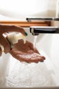 Hands of a young girl putting soap on herself Royalty Free Stock Photo