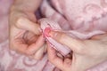 Hands of a young girl sew a button close up Royalty Free Stock Photo