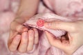 Hands of a young girl sew a button close up Royalty Free Stock Photo