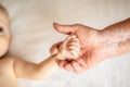 Hands of young great-grandson and old great-grandmother. Beautiful conceptual image of old age support. selective focus Royalty Free Stock Photo