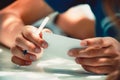 hands of a young man hold a fountain pen Royalty Free Stock Photo