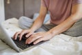 Hands of young man over laptop keypad during network Royalty Free Stock Photo