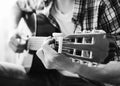 Hands of young man playing guitar. Black and white concept. Close-up Royalty Free Stock Photo