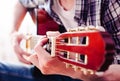 Hands of young man playing guitar. Guitar lesson concept.Close-up Royalty Free Stock Photo