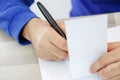 Hands of a young man writing on a piece of paper Royalty Free Stock Photo