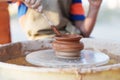 Hands of young potter, creating an earthen jar on the circle, cl Royalty Free Stock Photo