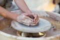 Hands of young potter, creating an earthen jar on the circle, cl Royalty Free Stock Photo