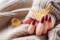 Hands of a young woman with dark red manicure on nails Royalty Free Stock Photo