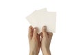 Hands of young woman with golden nail polish holding three blank business cards mockup, stationery template Royalty Free Stock Photo