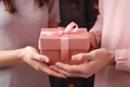 Hands young woman receiving gift box from hands loving man, surprise on Valentines Day