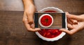 A hands young woman taking photo of food on smartphone Royalty Free Stock Photo