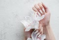 Hands of a young woman with white manicure on nails Royalty Free Stock Photo