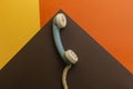 Handset of old retro phone isolated on colorful background Royalty Free Stock Photo