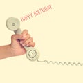 handset of a retro telephone and text happy birthday, with a retro effect