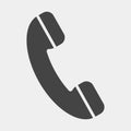 Handset vector icon. Phone icon in flat style on light-grey back