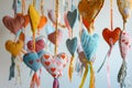 handsewn mobile with textile hearts and ribbons in nursery Royalty Free Stock Photo