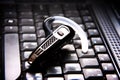 Handsfree bluetooth headset and laptop Royalty Free Stock Photo