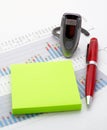 Handsfree, notes and pen on earnings chart background Royalty Free Stock Photo