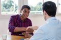 Handshake of african american male apprentice after job interview Royalty Free Stock Photo