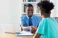 Handshake of african american male apprentice after job interview Royalty Free Stock Photo