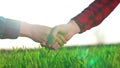 handshake agriculture. hands of group farmer business make a contract in the field. farmer handshake hands shaking hands