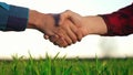 handshake agriculture. hands of group farmer business make a contract in the field. farmer handshake shaking hands on