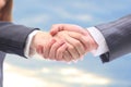 Handshake in the blue Royalty Free Stock Photo