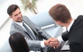 Handshake business partners in the lobby of the office. Royalty Free Stock Photo