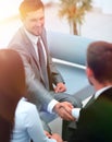 Handshake business partners in the lobby of the office. Royalty Free Stock Photo