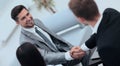 Handshake business partners in the lobby of the office. Royalty Free Stock Photo