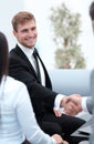 Handshake business partners in the lobby of the office. Royalty Free Stock Photo