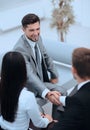 Handshake business partners in the lobby of the office. Royalty Free Stock Photo