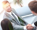 Handshake business partners in the lobby of the office. Royalty Free Stock Photo