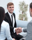 Handshake business partners in the lobby of the office. Royalty Free Stock Photo