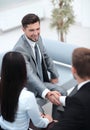 Handshake business partners in the lobby of the office. Royalty Free Stock Photo