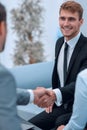 Handshake business partners in the lobby of the office. Royalty Free Stock Photo