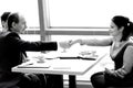 Handshake of a businessman and business woman over a Desk. Royalty Free Stock Photo