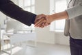 Handshake of businessmen. Female and male hand makes a handshake in the office. Royalty Free Stock Photo