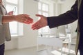 Handshake of businessmen. Female and male hand makes a handshake in the office. Royalty Free Stock Photo