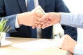 Handshake of businessmen with money. Bribe Royalty Free Stock Photo