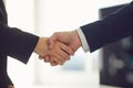 Handshake of businesspeople. Businesspeople hands makes a handshake in the office.