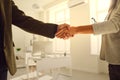 Handshake of businesspeople. Female and male hand makes a handshake in the office. Royalty Free Stock Photo
