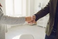 Handshake of businesspeople. Female and male hand makes a handshake in the office. Royalty Free Stock Photo