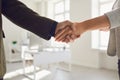 Handshake of businesspeople. Female and male hand makes a handshake in the office. Royalty Free Stock Photo