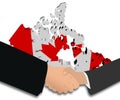 Handshake with Canada map flag Royalty Free Stock Photo