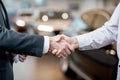 Handshake of a client and salesperson