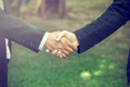 Handshake. It is a collective agreement to work. In the garden. Royalty Free Stock Photo