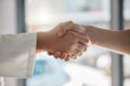 Handshake, deal and business partnership or agreement, closeup at office window. Shaking hands, thank you and a Royalty Free Stock Photo