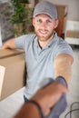 handshake entrepreneur sme to receive parcel from deliveryman Royalty Free Stock Photo