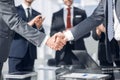 Handshake of financial partners in the office
